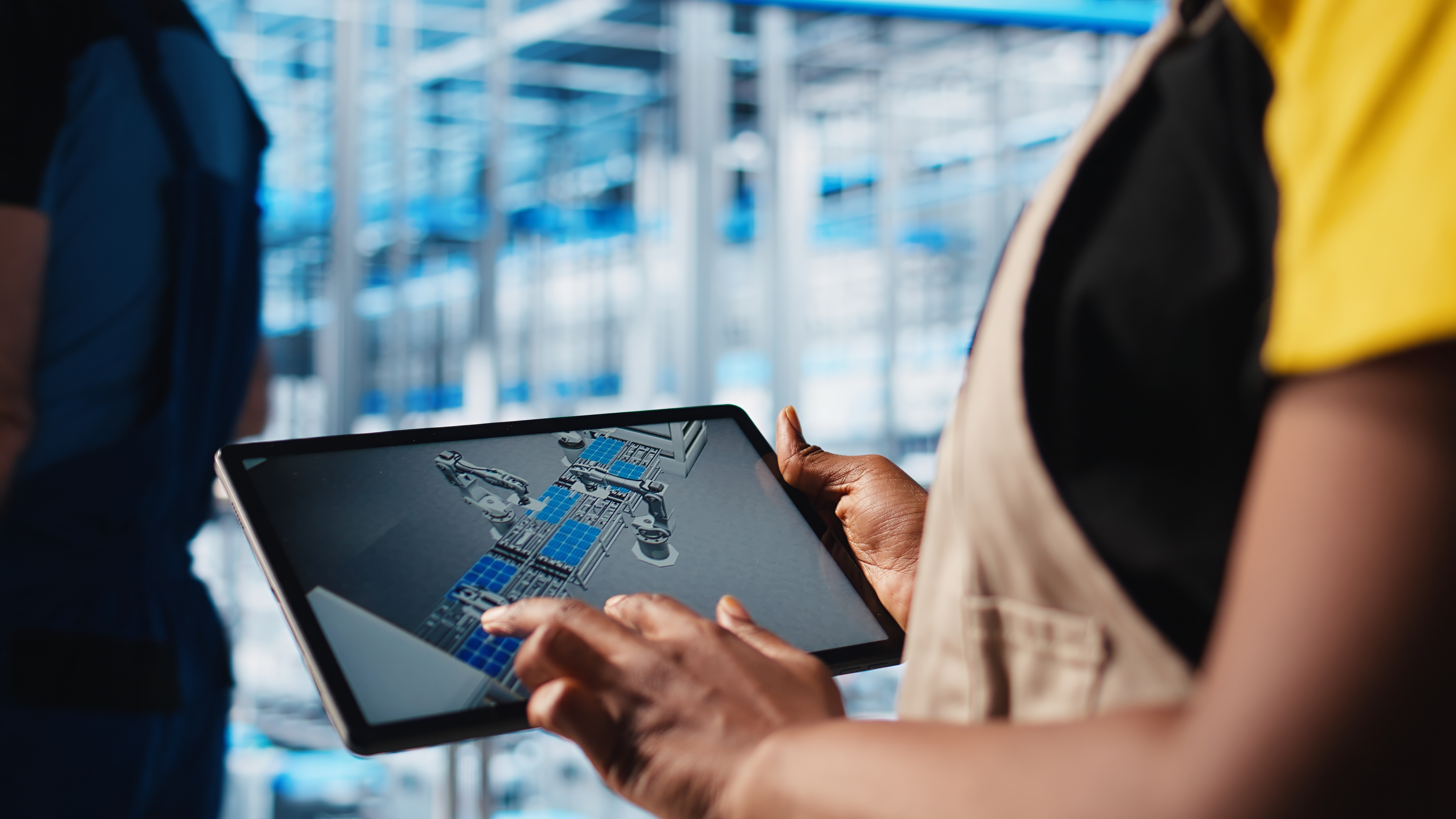 smart factory engineer designs robotic machines using cad software